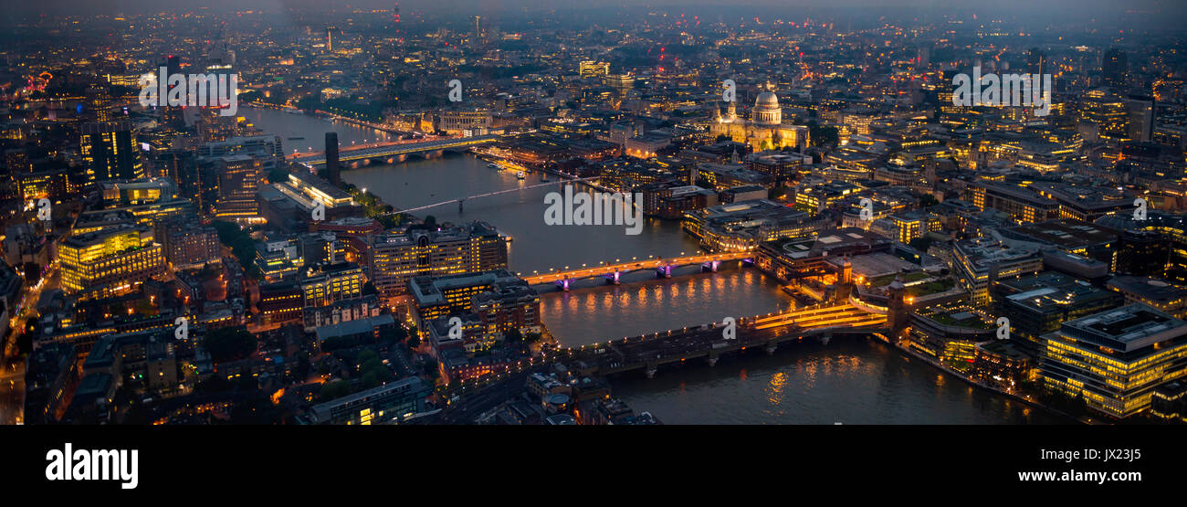 View of River Thames with London Bridge, Millenium Bridge and St. Paul's Cathedral, dusk, aerial view, London, England Stock Photo