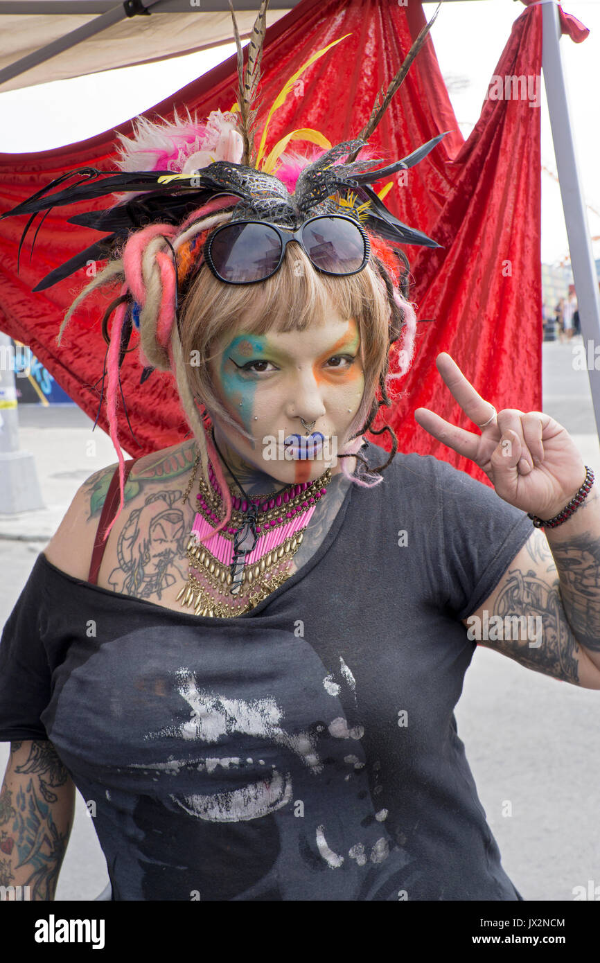 Photo of woman stylist in elaborate makeup at a street fair in Coney Island, Brooklyn, New York City. Stock Photo