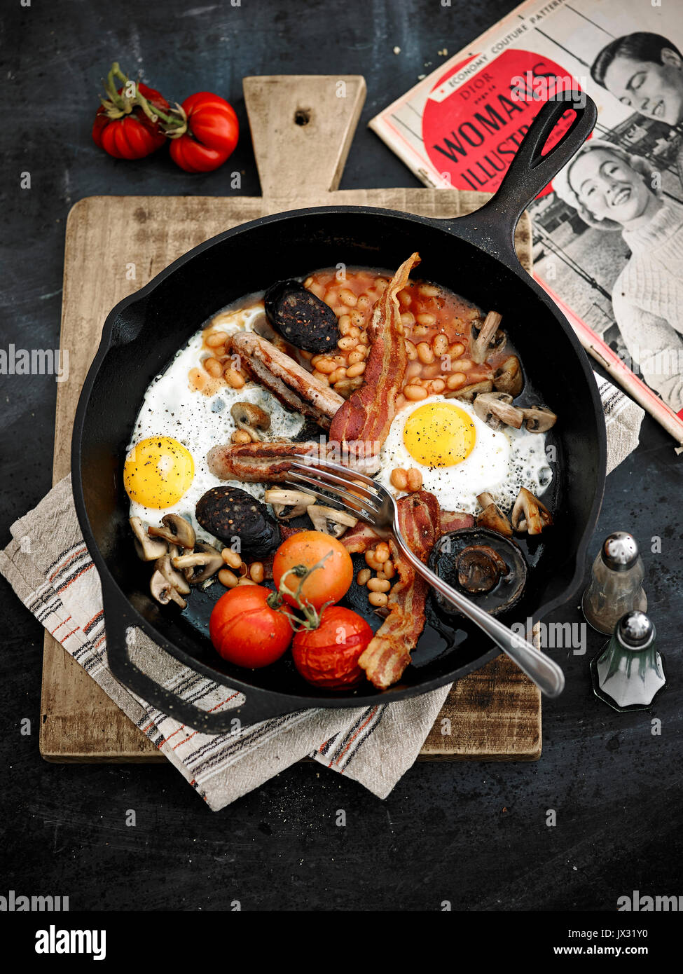 Full English breakfast in one cast iron pan Stock Photo