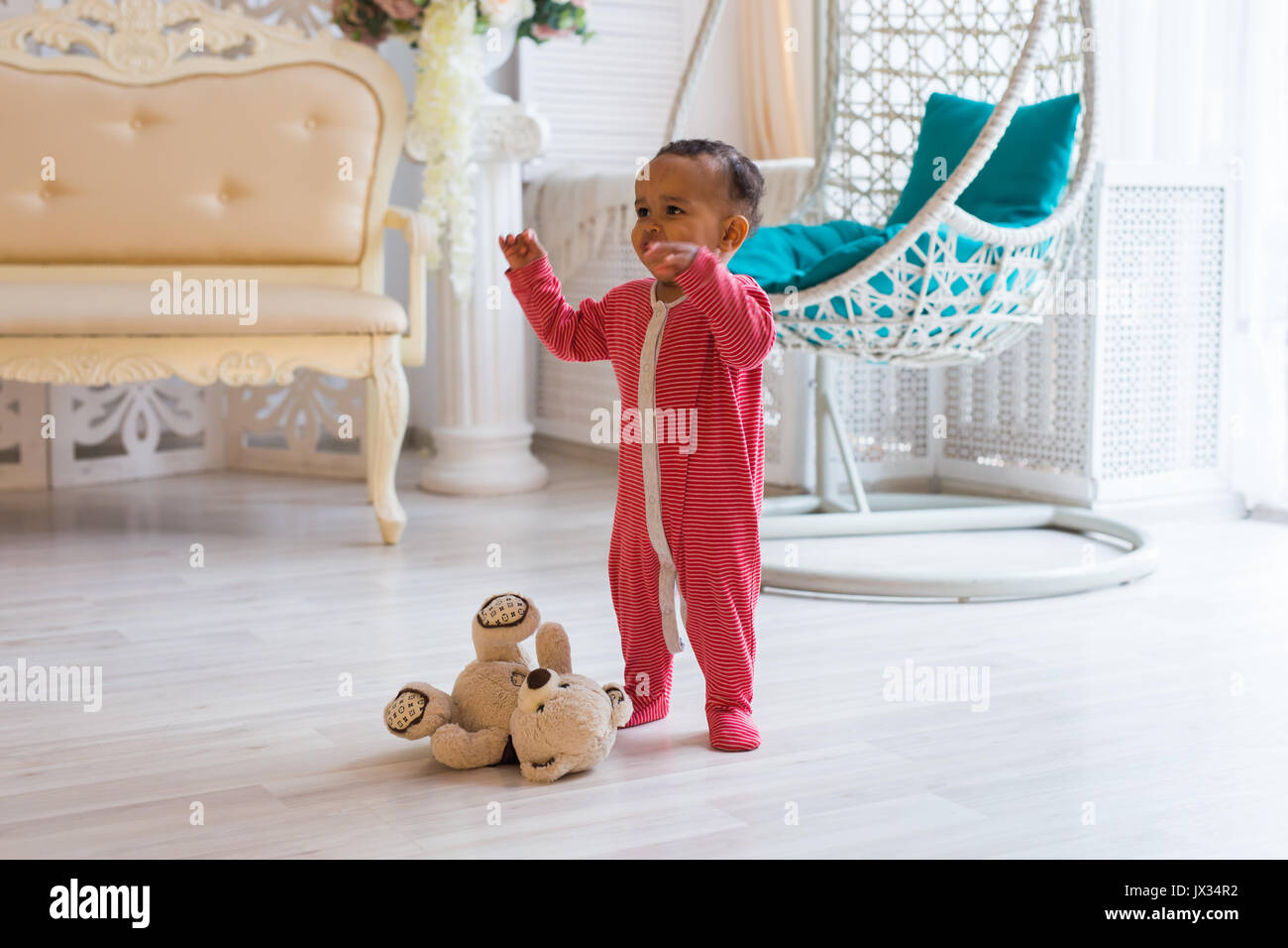 Full length portrait of mixed race baby boy in the home Stock Photo - Alamy