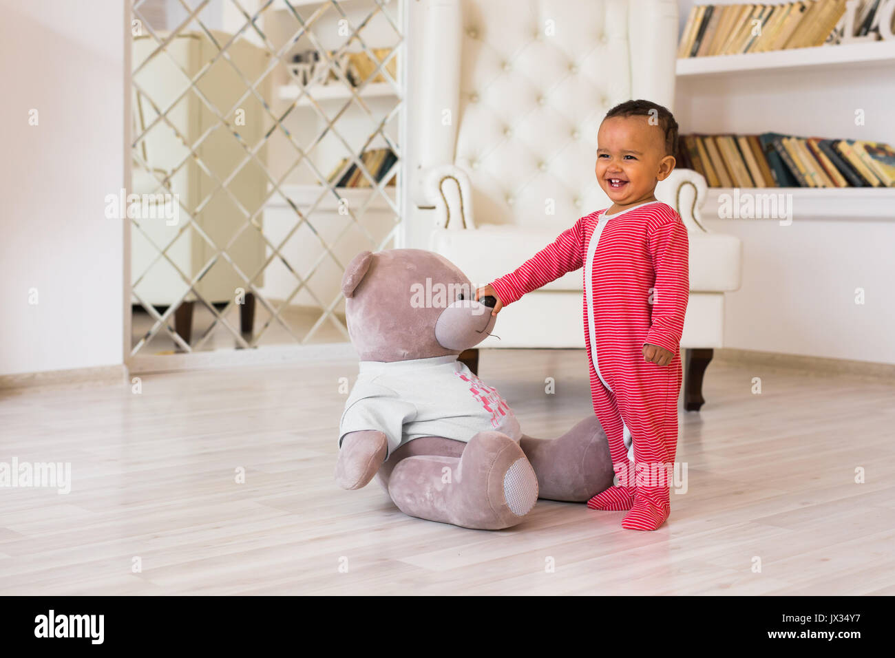 Full length portrait of mixed race baby boy in the home Stock Photo - Alamy