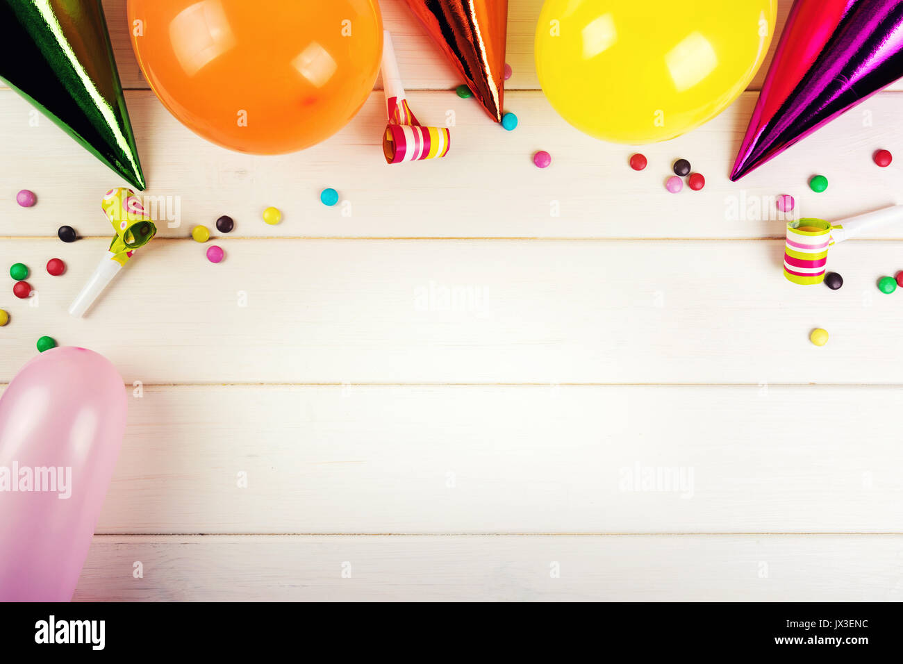 birthday party accessories with copy space on white wood background Stock Photo