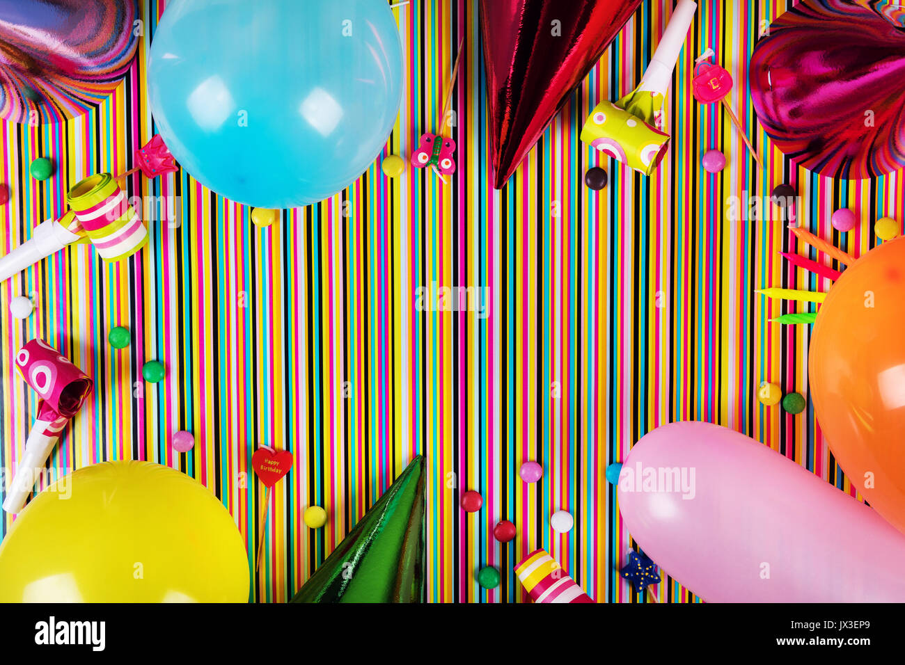birthday party items on striped background with copy space. top view Stock Photo