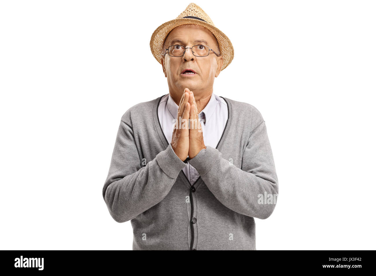 Mature man praying isolated on white background Stock Photo