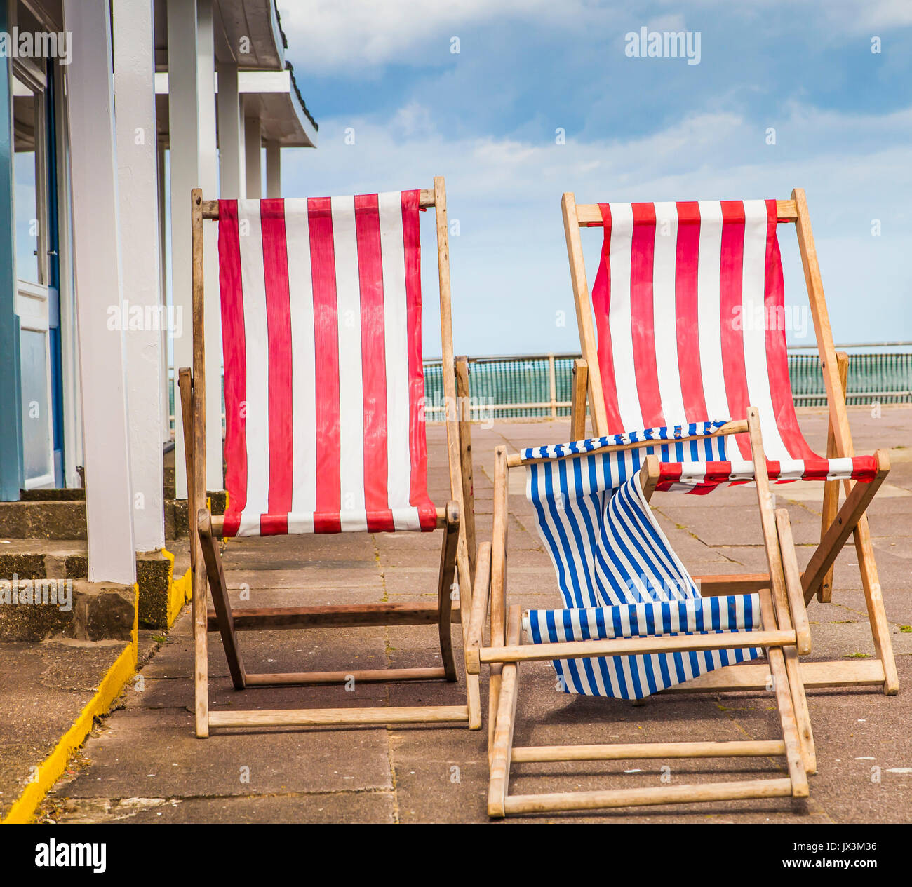 Deck Chairs on windy day on East Coast UK Stock Photo