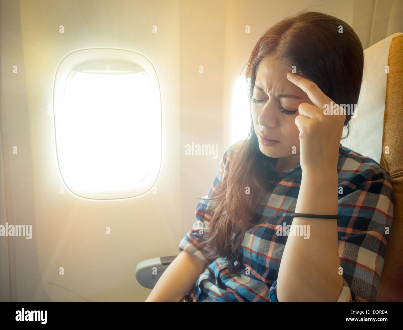 portrait of hair woman headache facial expression on a chair