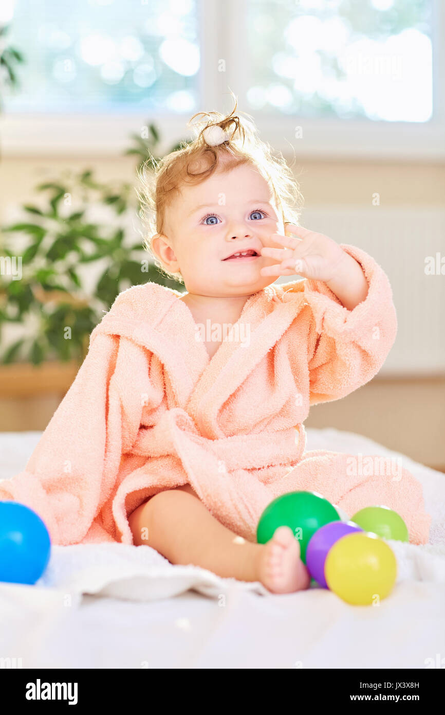 Baby in the bathrobe after the bath. Stock Photo