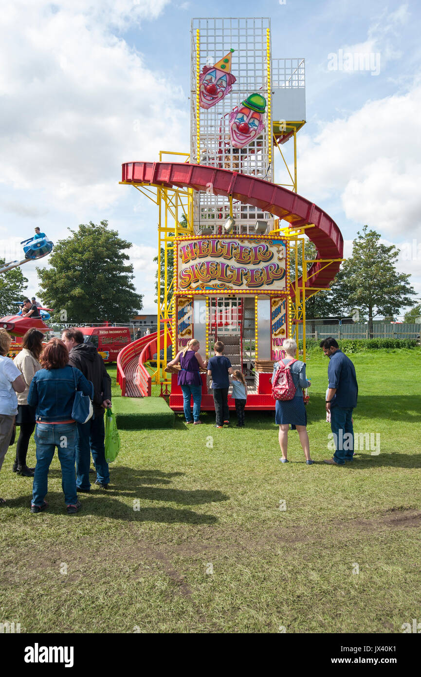 Children and Adults waiting to ride on the Helter Skelter at a vintage  steam faire Stock Photo - Alamy