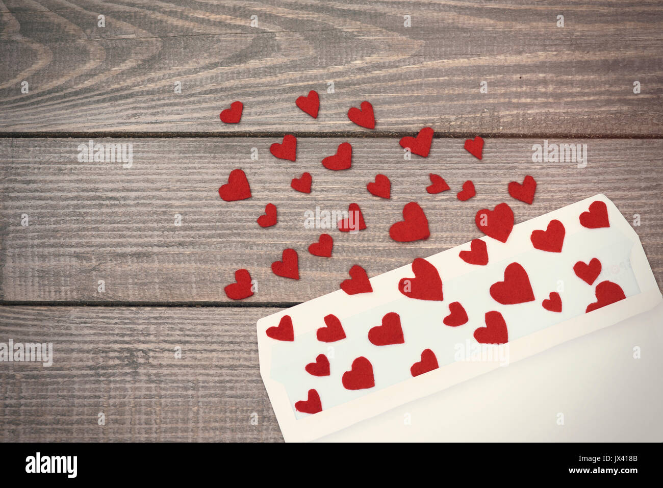 Opened envelope and many felt hearts Stock Photo