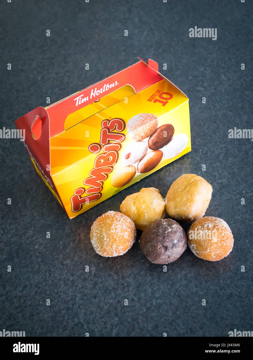 Timbits (donut holes, doughnut holes) from Tim Hortons, a popular Canadian fast food restaurant chain. Stock Photo