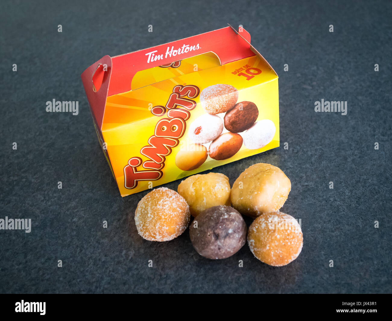 Timbits (donut holes, doughnut holes) from Tim Hortons, a popular Canadian fast food restaurant chain. Stock Photo