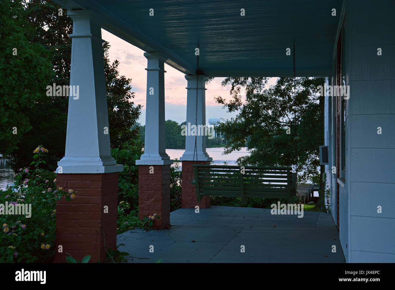 The porch of a home overlooking the Perquiman's river at sunset in the small town of Hertford North Carolina. Stock Photo