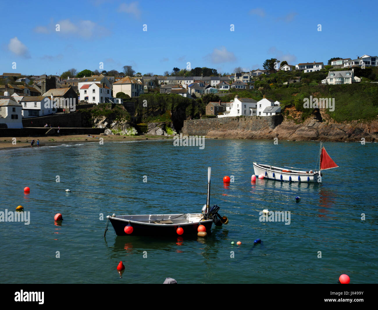 Fishing boats moored off the beach at Gorran Haven, Cornwall. Stock Photo