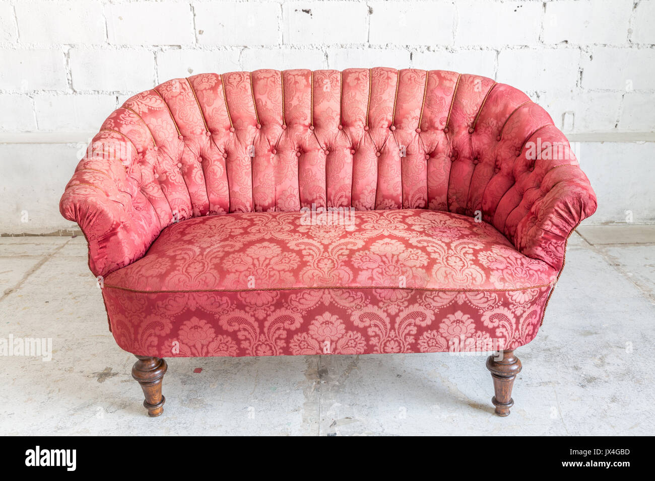 Red sofa couch in vintage room - classical style Stock Photo