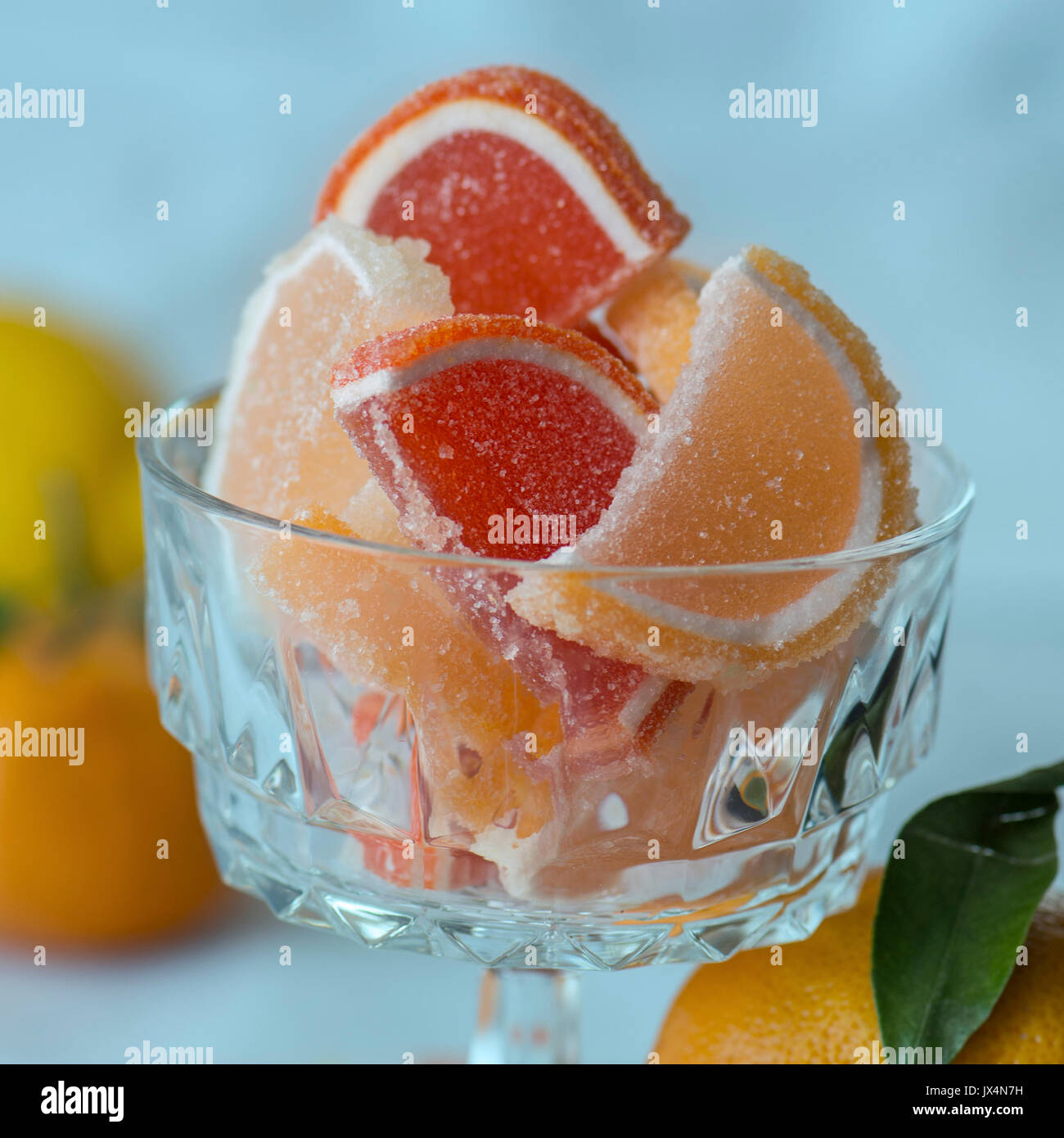 Candied citrus fruit in a glass compote Stock Photo