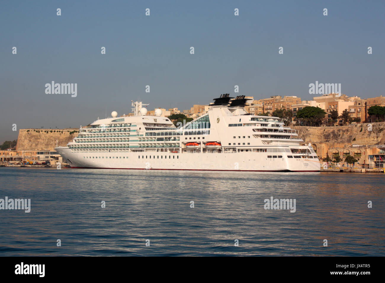 Mediterranean travel. The cruise ship or liner Seabourn Odyssey moored by the fortifications of Valletta, Malta Stock Photo