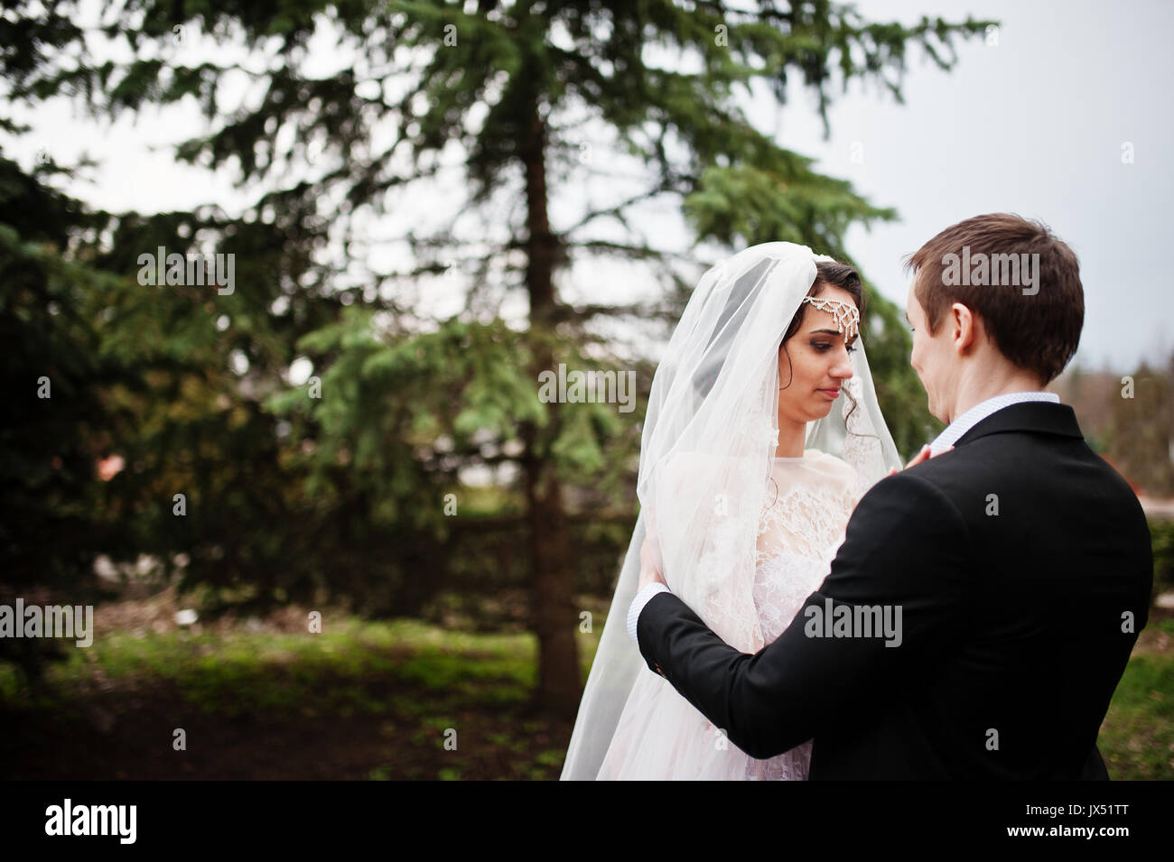 Happy newlyweds posing in park hi-res stock photography and images - Alamy