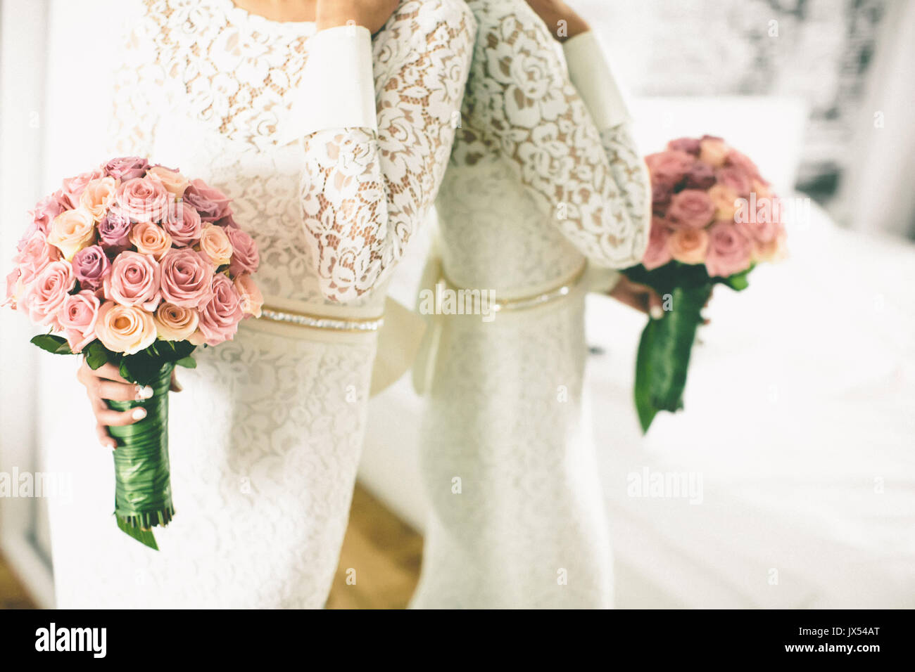 Wedding bouquet of roses in the hands of the bride Stock Photo - Alamy