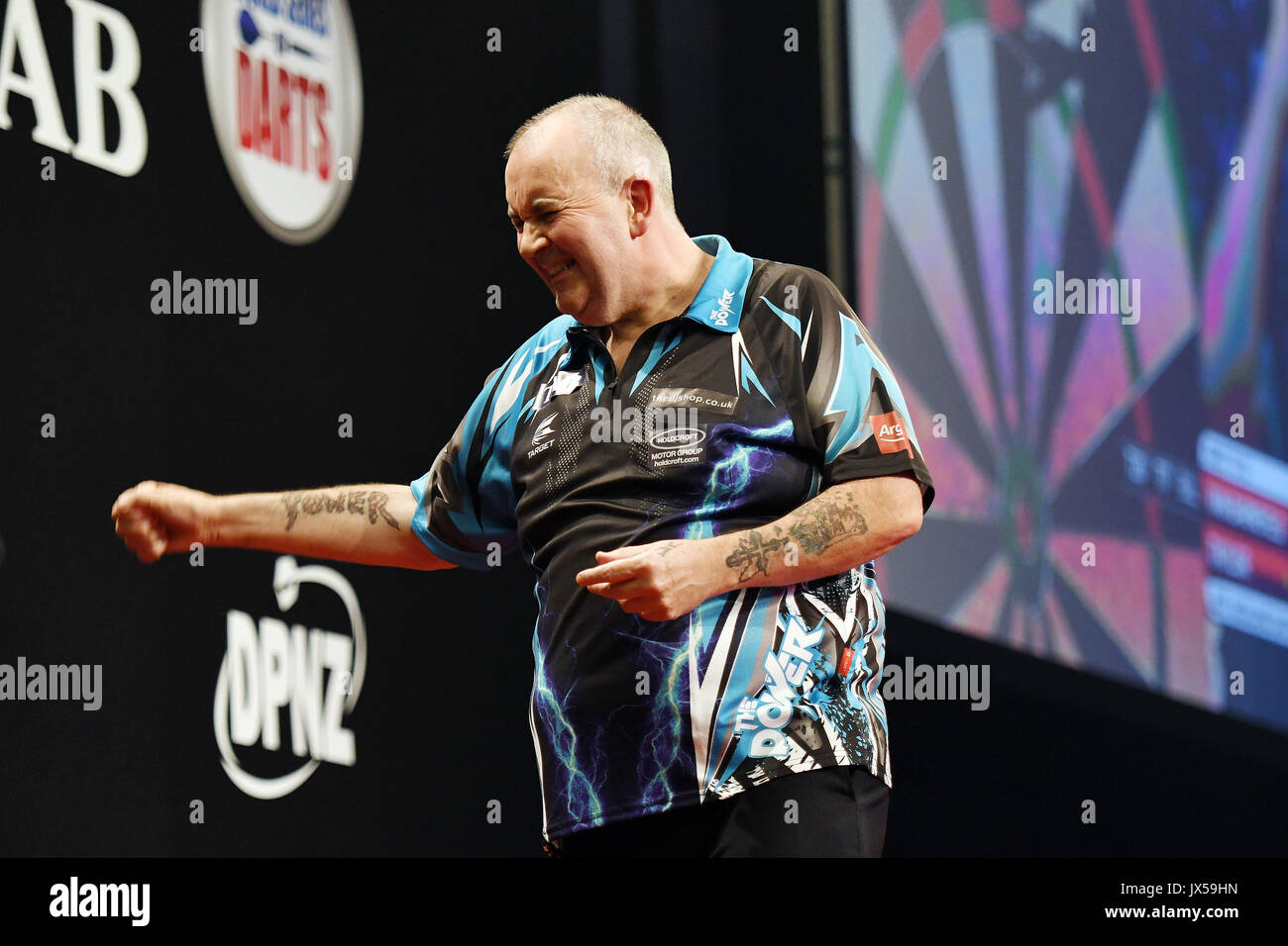 August 12th 2017, Auckland, New Zealand; Phil Taylor celebrates his victory  over Raymond van Barneveld during Day 2 of the Auckland Darts Masters 2017.  Trusts Arena, Henderson. Saturday 12th August 2017 Stock Photo - Alamy