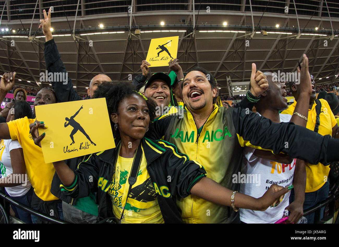 London, UK. 13th Aug, 2017. Spectators dressed in Jamaican colours party as they wait to see Legend Usain Bolt during the Final Day of the IAAF World Athletics Championships (Day 10) at the Olympic Park, London, England on 13 August 2017. Photo by Andy Rowland/PRiME Media Images. Credit: Andrew Rowland/Alamy Live News Stock Photo