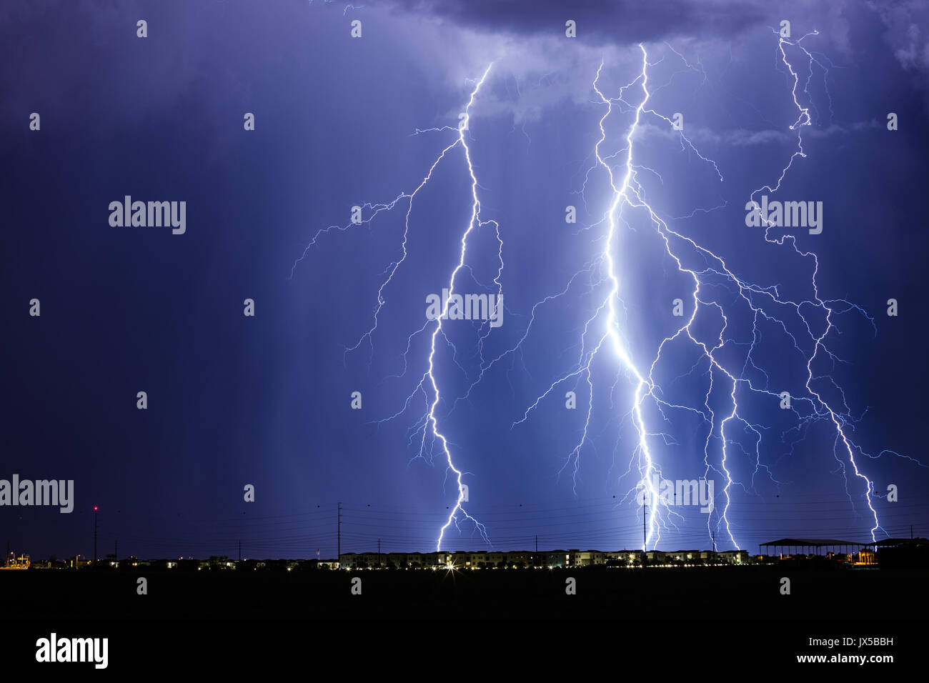 Lightning fills the night sky as monsoon thunderstorms bring heavy rain and wind in Chandler, USA Stock Photo