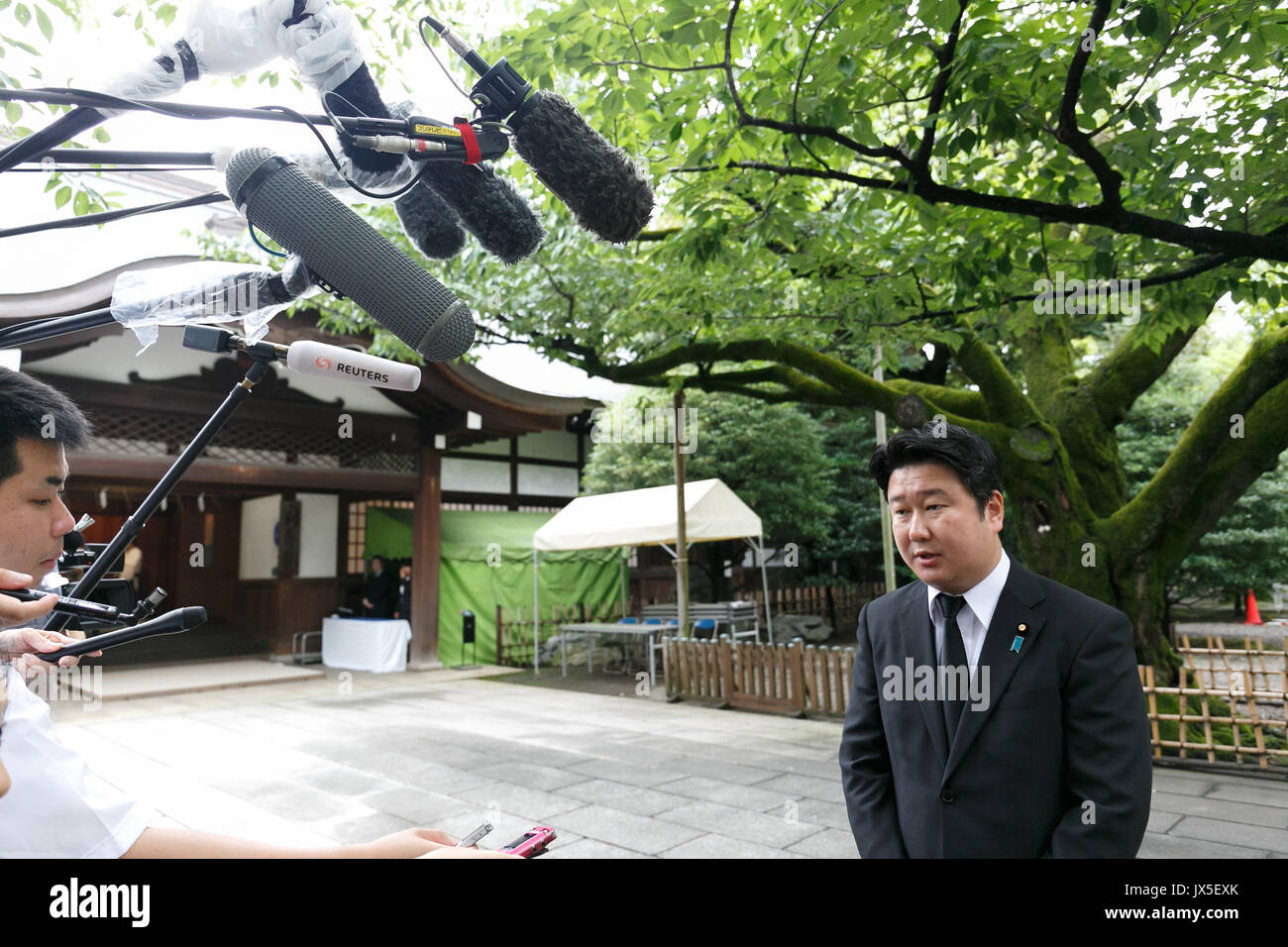 Tokyo, Japan. 15th Aug, 2017. Japanese politician Masamune Wada answers questions from the press at Yasukuni Shrine on the 72nd anniversary of Japan's surrender in World War II on August 15, 2017, Tokyo, Japan. Prime Minister Shinzo Abe was not among the lawmakers to visit the Shrine and instead sent a ritual offering to avoid angering neighboring countries who also associate Yasukuni with war criminals and Japan's imperial past. Credit: Rodrigo Reyes Marin/AFLO/Alamy Live News Stock Photo