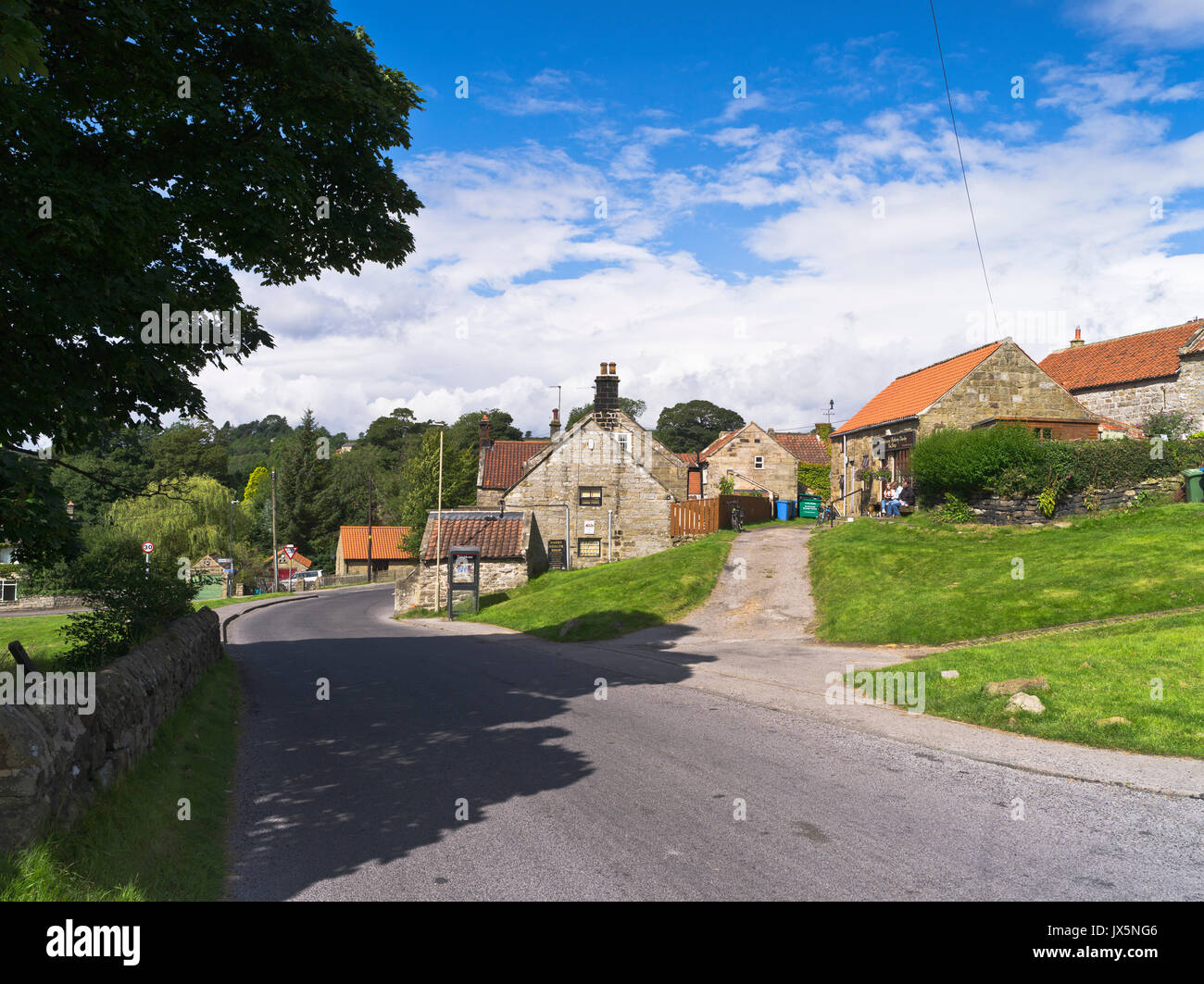 dh North Yorkshire Moors DANBY NORTH YORKSHIRE Tourist relaxing village shop traditional houses people road york moor villages yorks Stock Photo