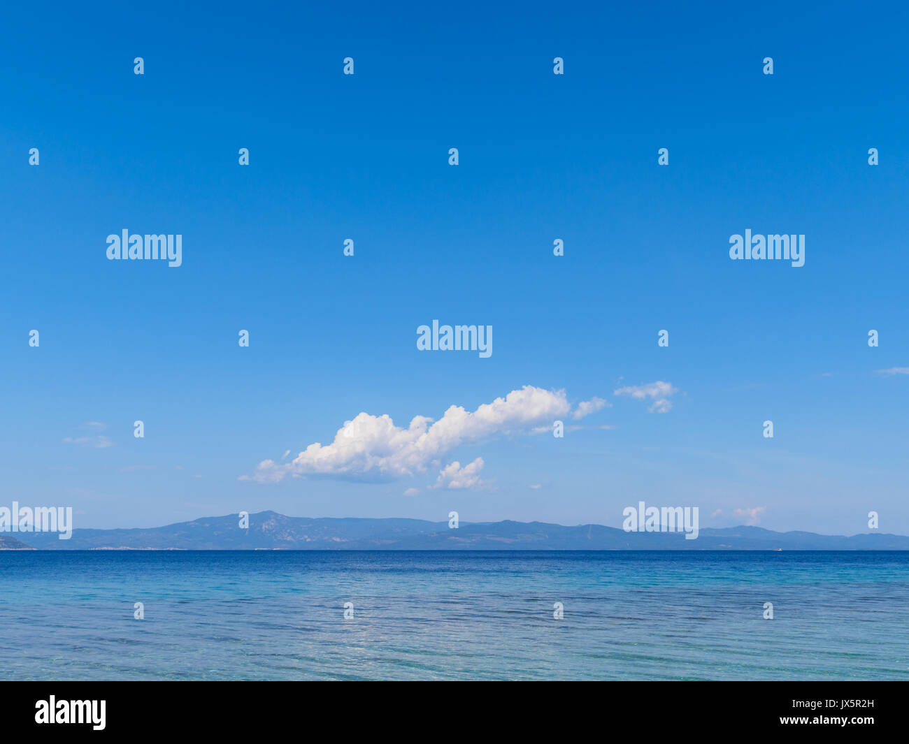 Blue sky with clouds over beach hi-res stock photography and images - Alamy