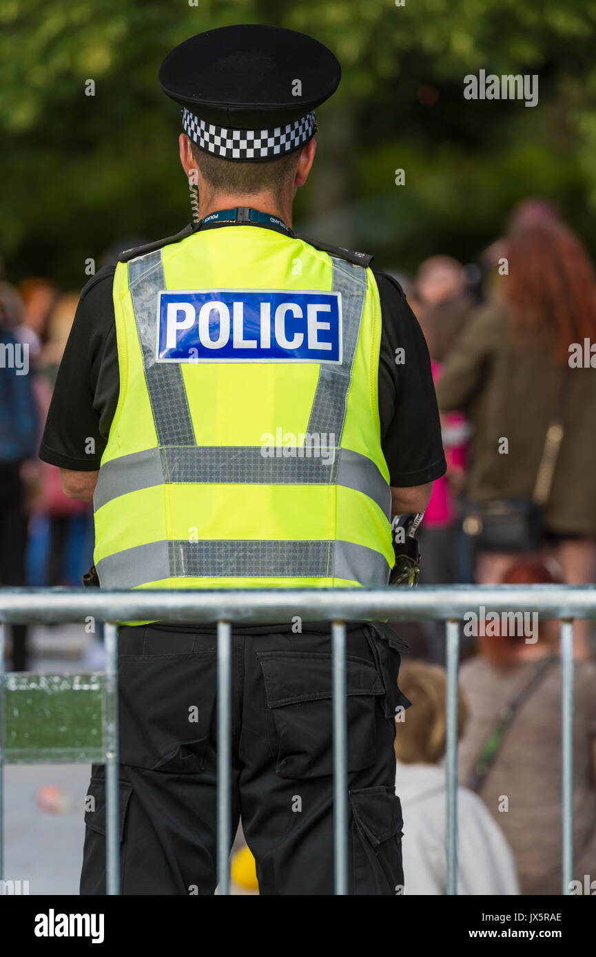 Dumfries, Scotland - August 12, 2017:  A Police Scotland policeman on duty at a youth music festival. Stock Photo
