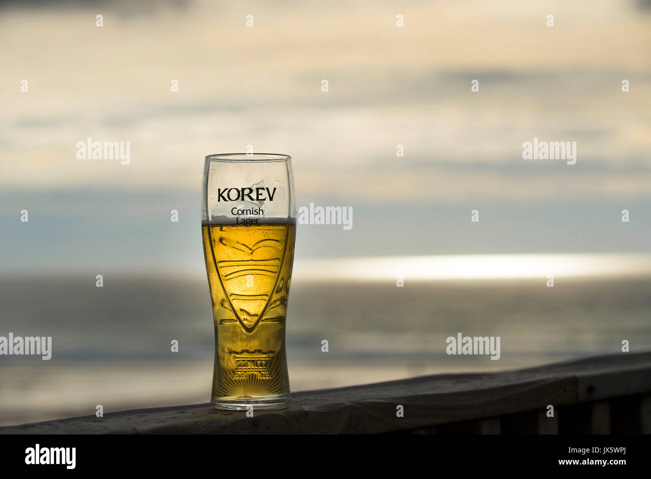 A partially consumed pint of Korev lager. Stock Photo