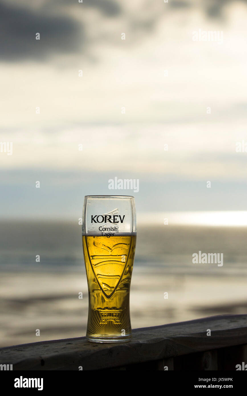 A partially consumed pint of Korev lager. Stock Photo