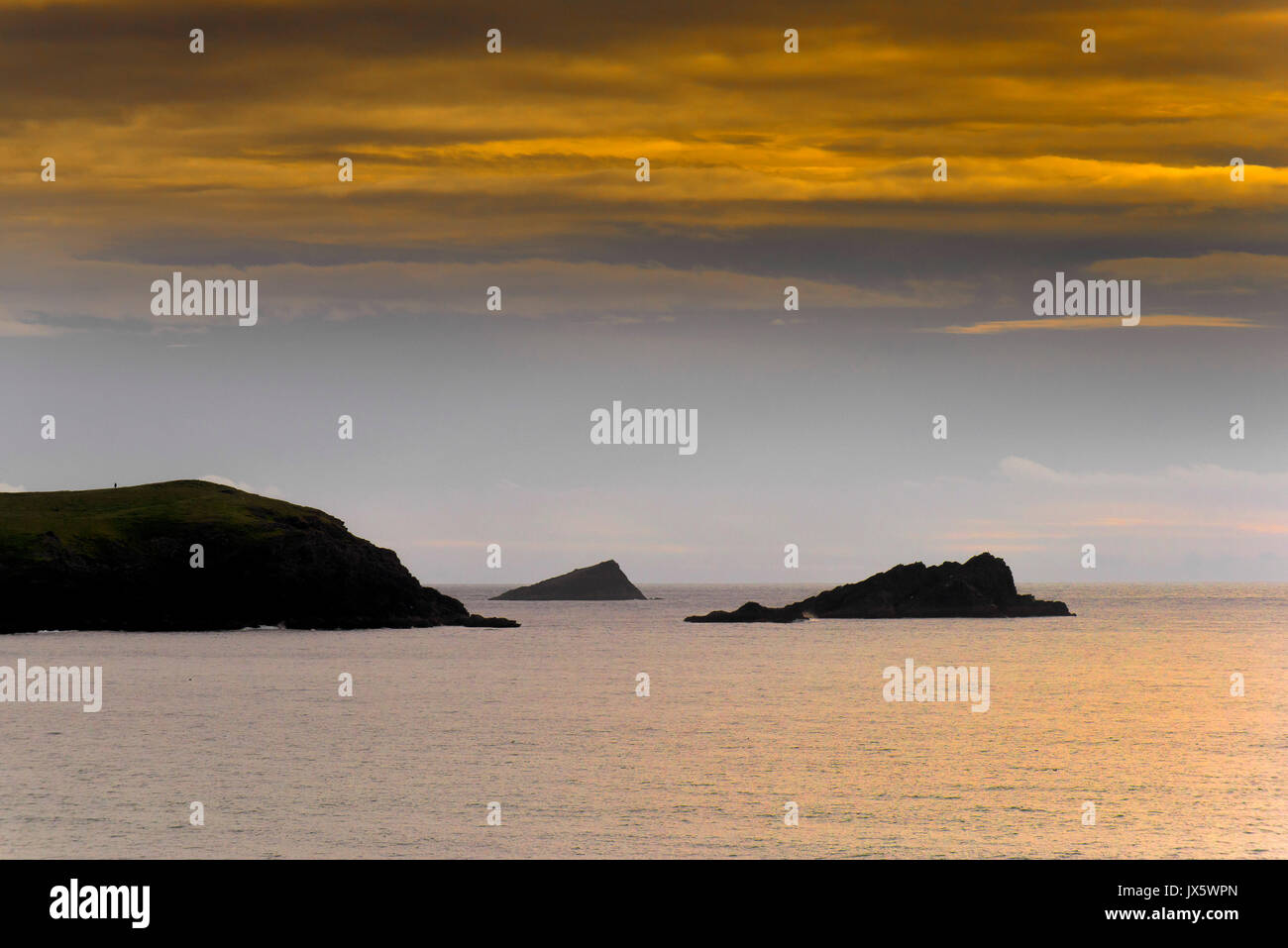 The Chick, a small island seen between East Pentire headland and The Goose. Stock Photo