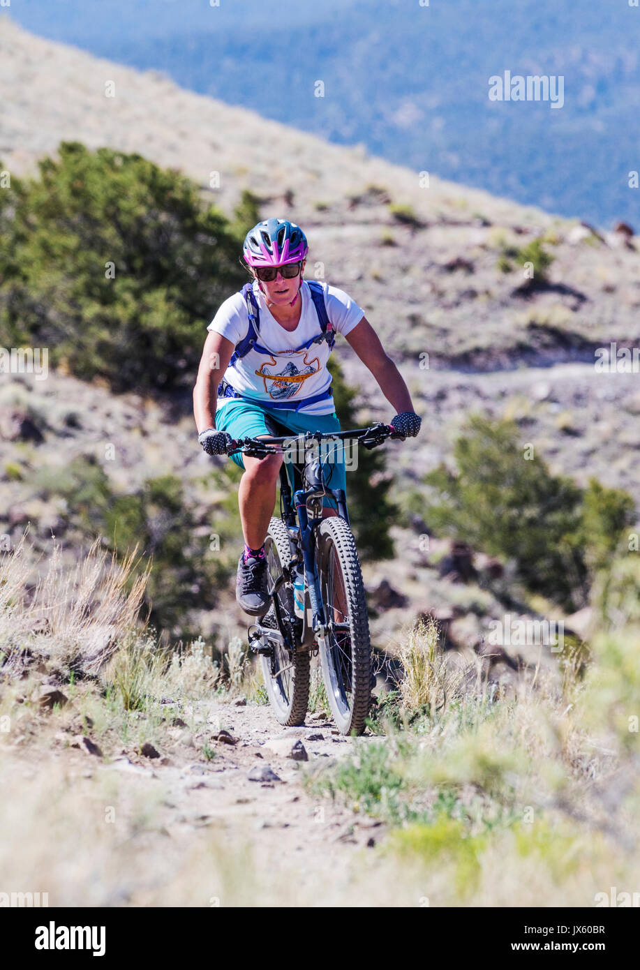Female cyclist competes in the Fibark Festival mountain bike race