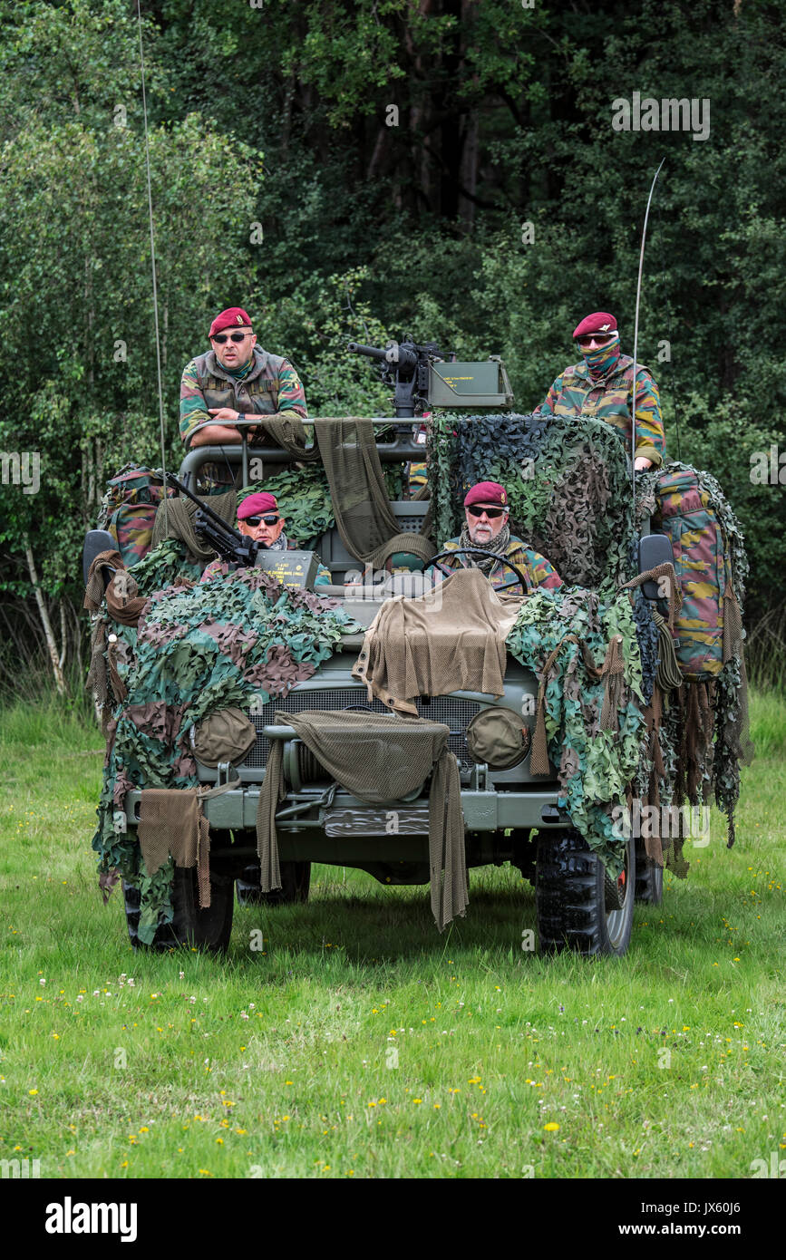 Belgian paracommandos of the Para-Commando Regiment manning camouflaged LRPV armoured vehicle, the Mercedes-Benz Unimog Stock Photo