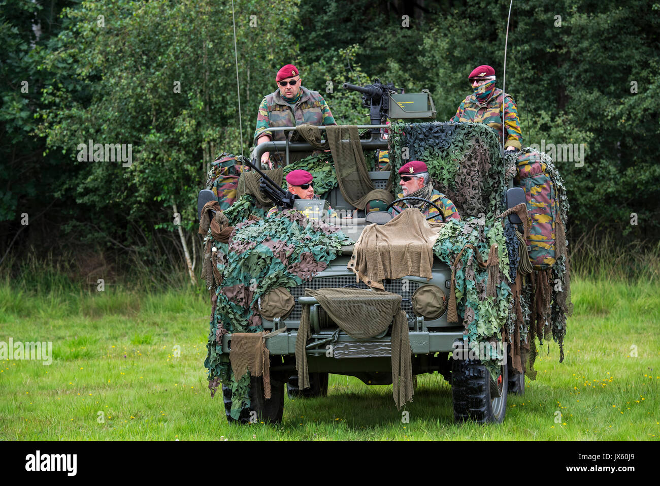 Belgian paracommandos of the Para-Commando Regiment manning camouflaged LRPV armoured vehicle, the Mercedes-Benz Unimog 404 Stock Photo