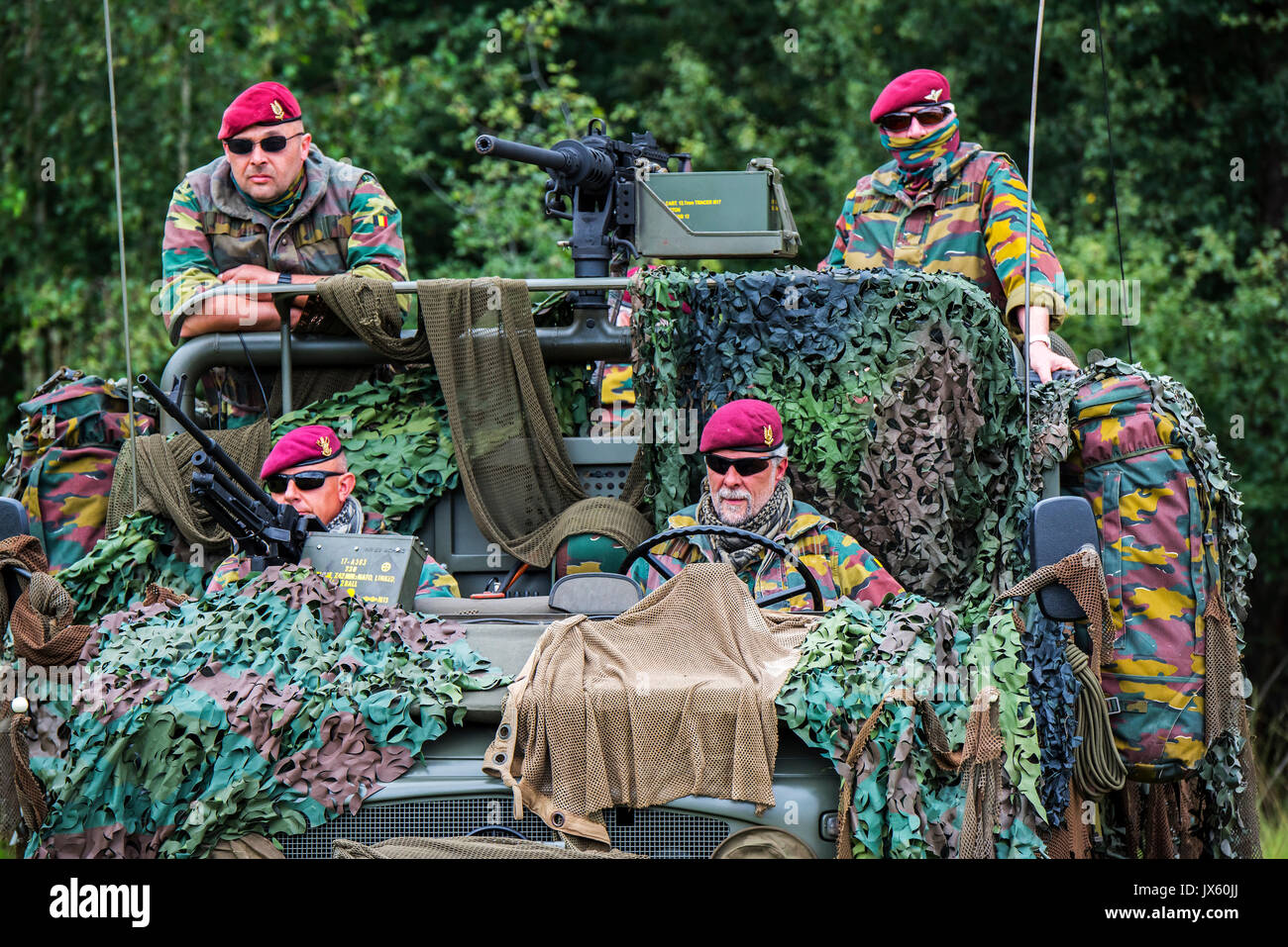 Belgian paracommandos of the Para-Commando Regiment manning camouflaged LRPV armoured vehicle, the Mercedes-Benz Unimog 404 Stock Photo