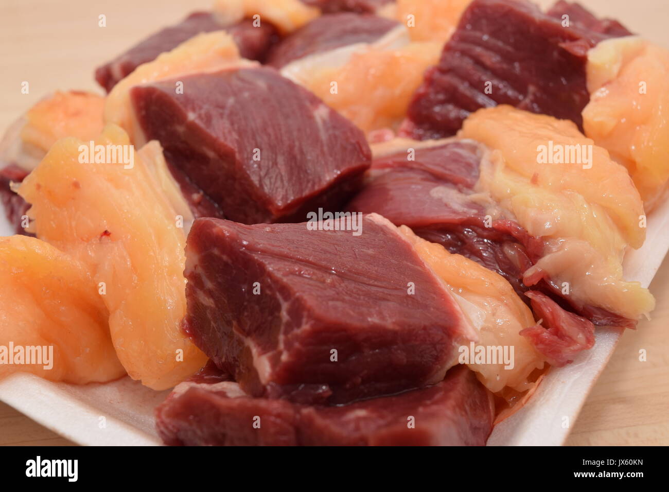 Diced raw meat in pile Stock Photo
