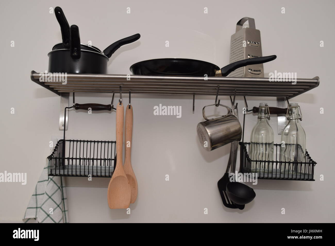 Kitchen utensils hanging on the wall Stock Photo Alamy