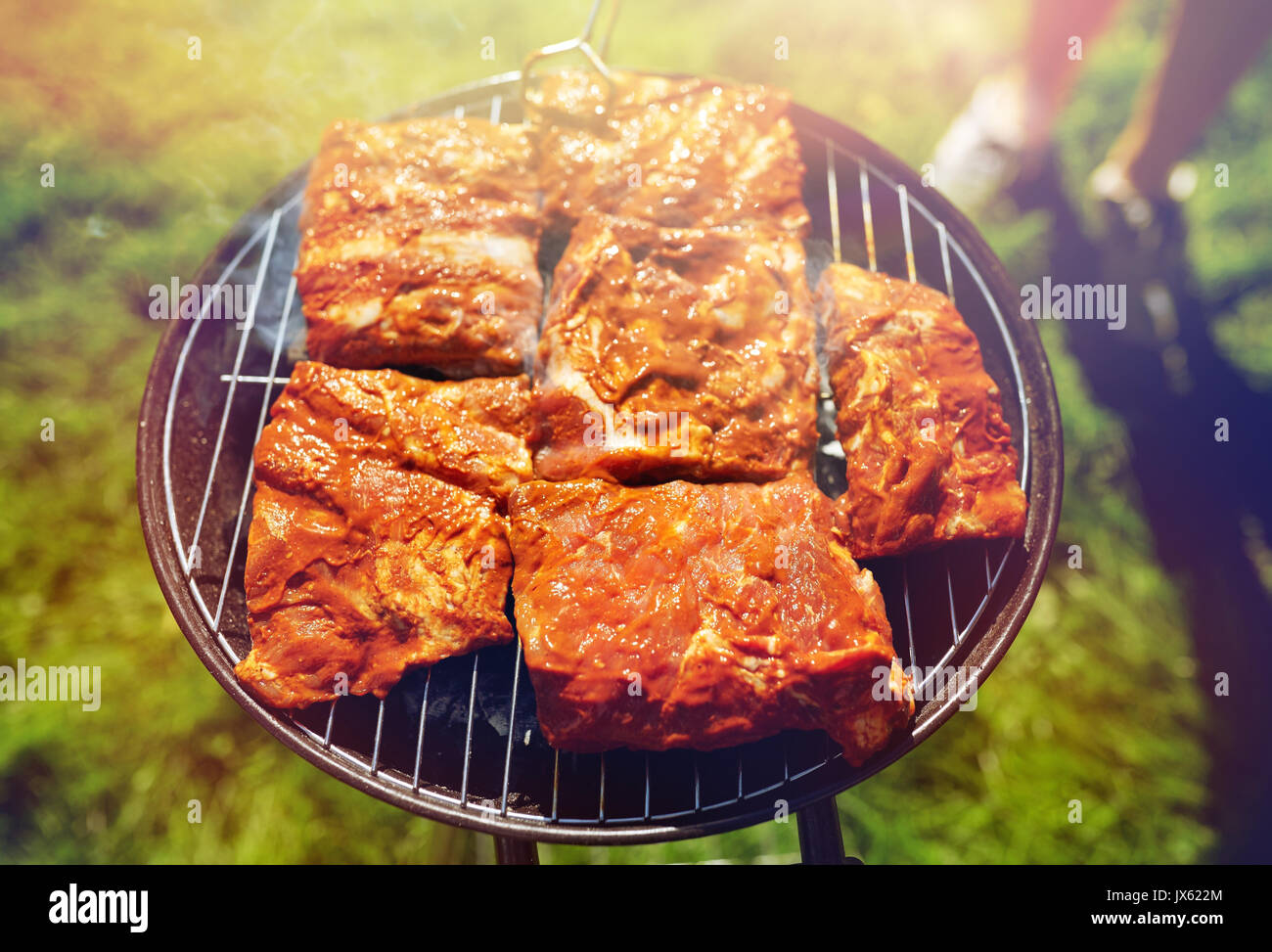 meat cooking on barbecue grill at summer party Stock Photo Alamy