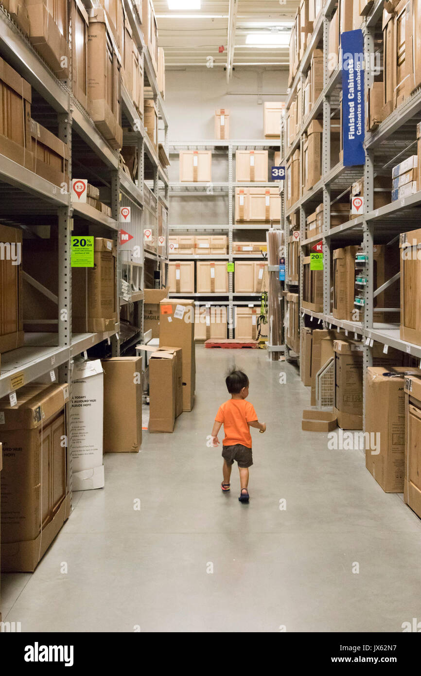 toddler in aisle, Lowe's hardware store, Pasco, Washington State, USA Stock Photo