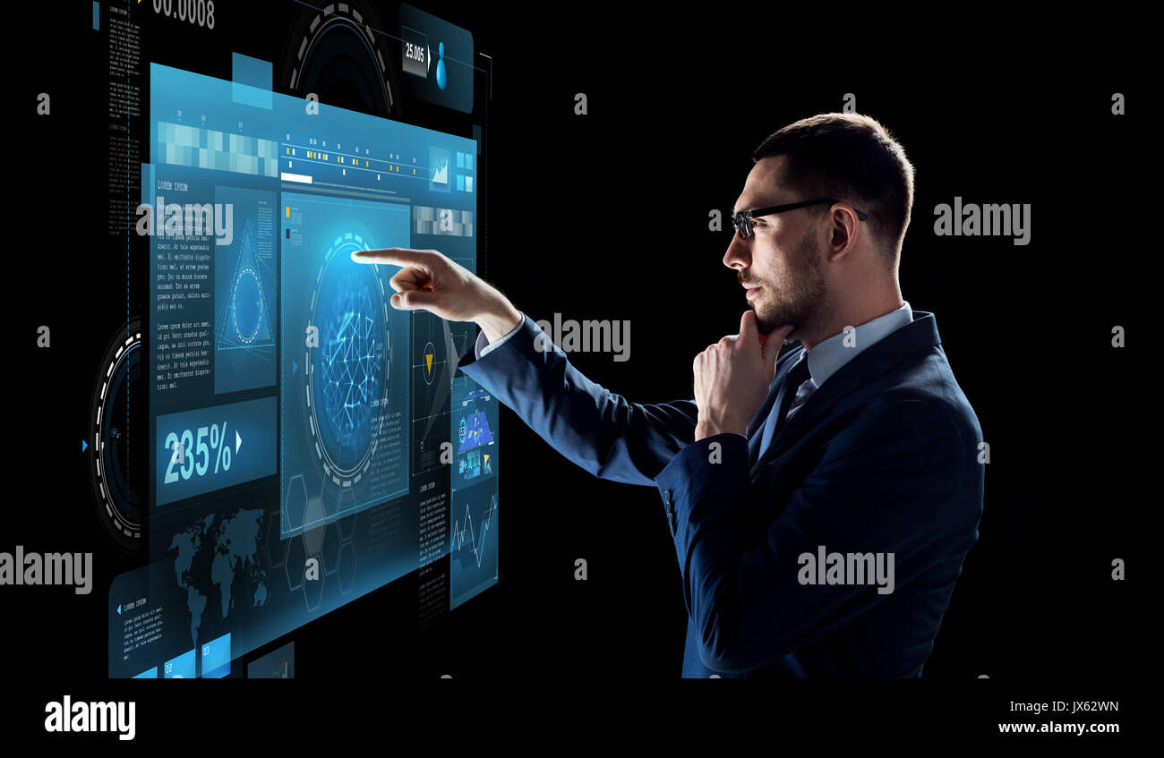 businessman with virtual screen over black Stock Photo