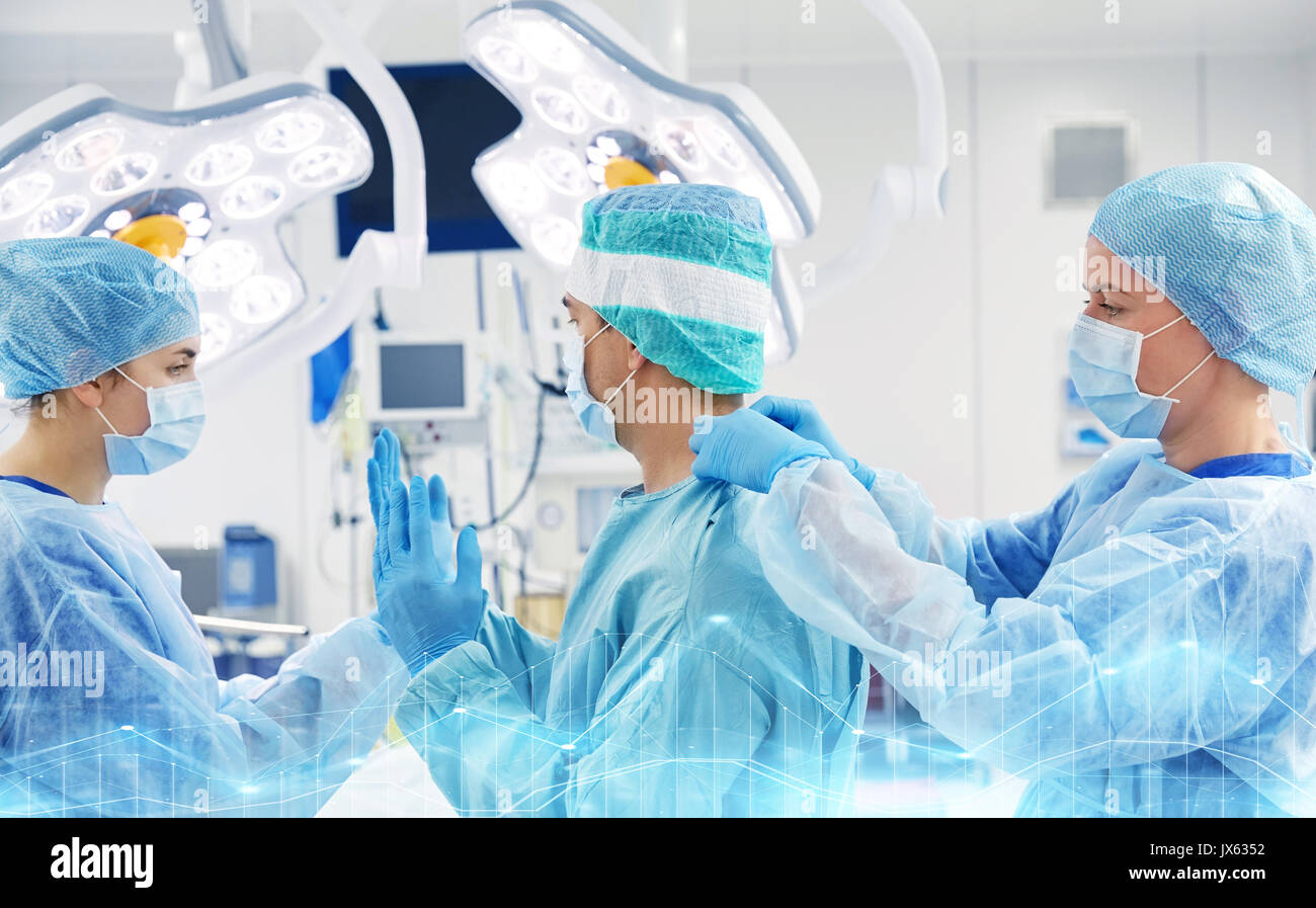 surgeons in operating room at hospital Stock Photo - Alamy