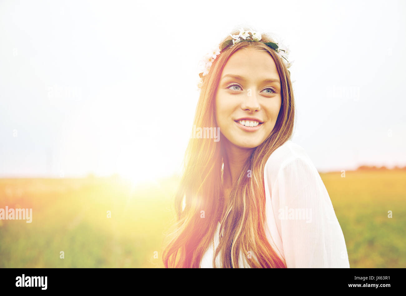 smiling young hippie woman on cereal field Stock Photo
