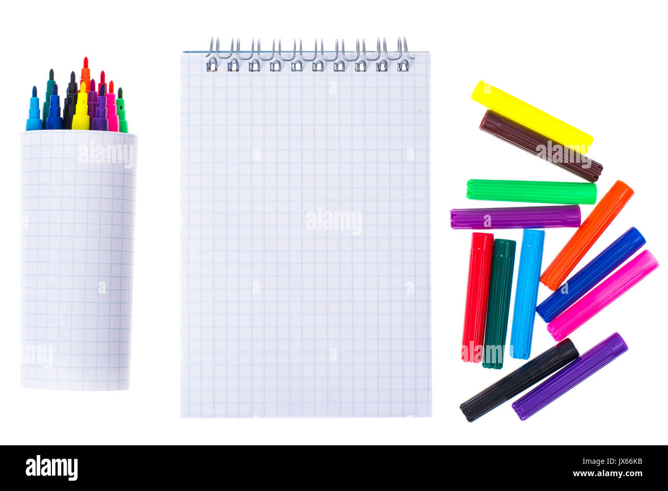 Open spiral blank notebook with color markers on white background ...