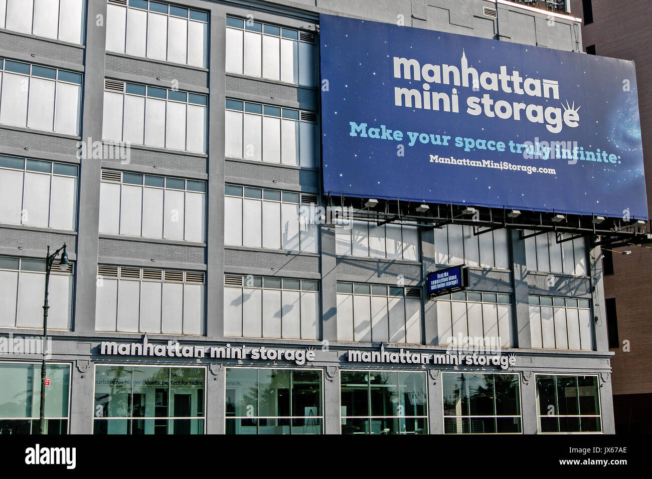 Manhattan Mini Storage billboard is attached to the exterior of their facility near West Side highway in midtown. Stock Photo