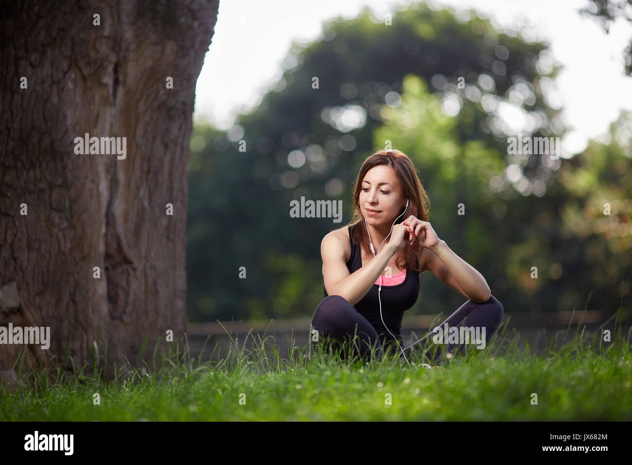 Woman enjoying music while resting Stock Photo