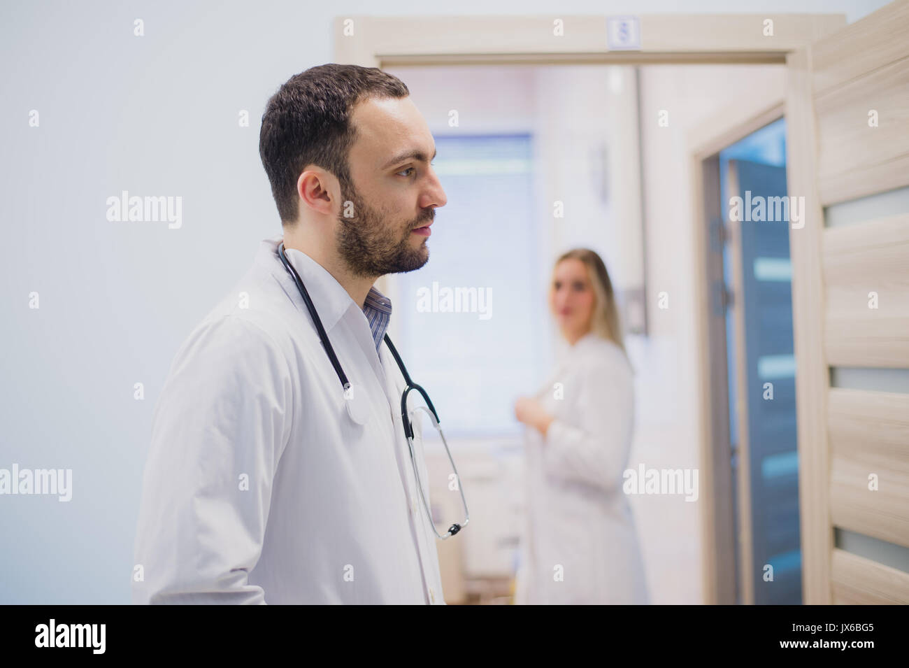 Doctor white coat holding hi-res stock photography and images - Alamy