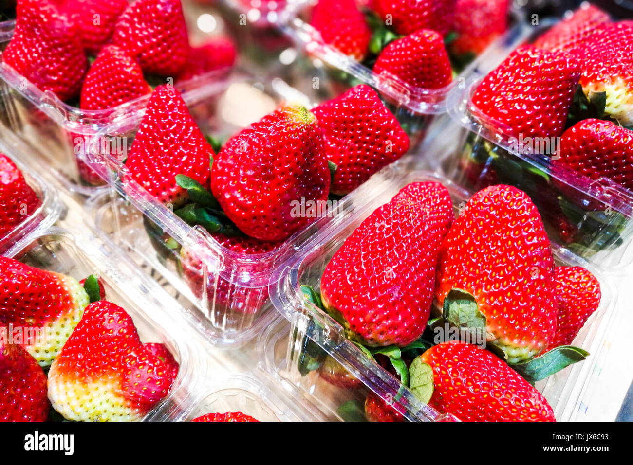 Big strawberries in plastic containers 