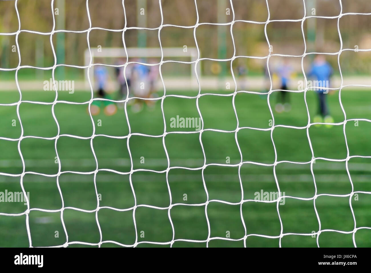 Behind Goal Of Soccer Field Soccer Football Net Background Over Green Grass Or Soccer Field And Blurry Stadium And Soccer Players Football Soccer F Stock Photo Alamy Behind Goal Of Soccer Field Soccer Football Net Background Over Green Grass Or Soccer Field And Blurry Stadium And Soccer Players Football Soccer F Stock Photo Alamy