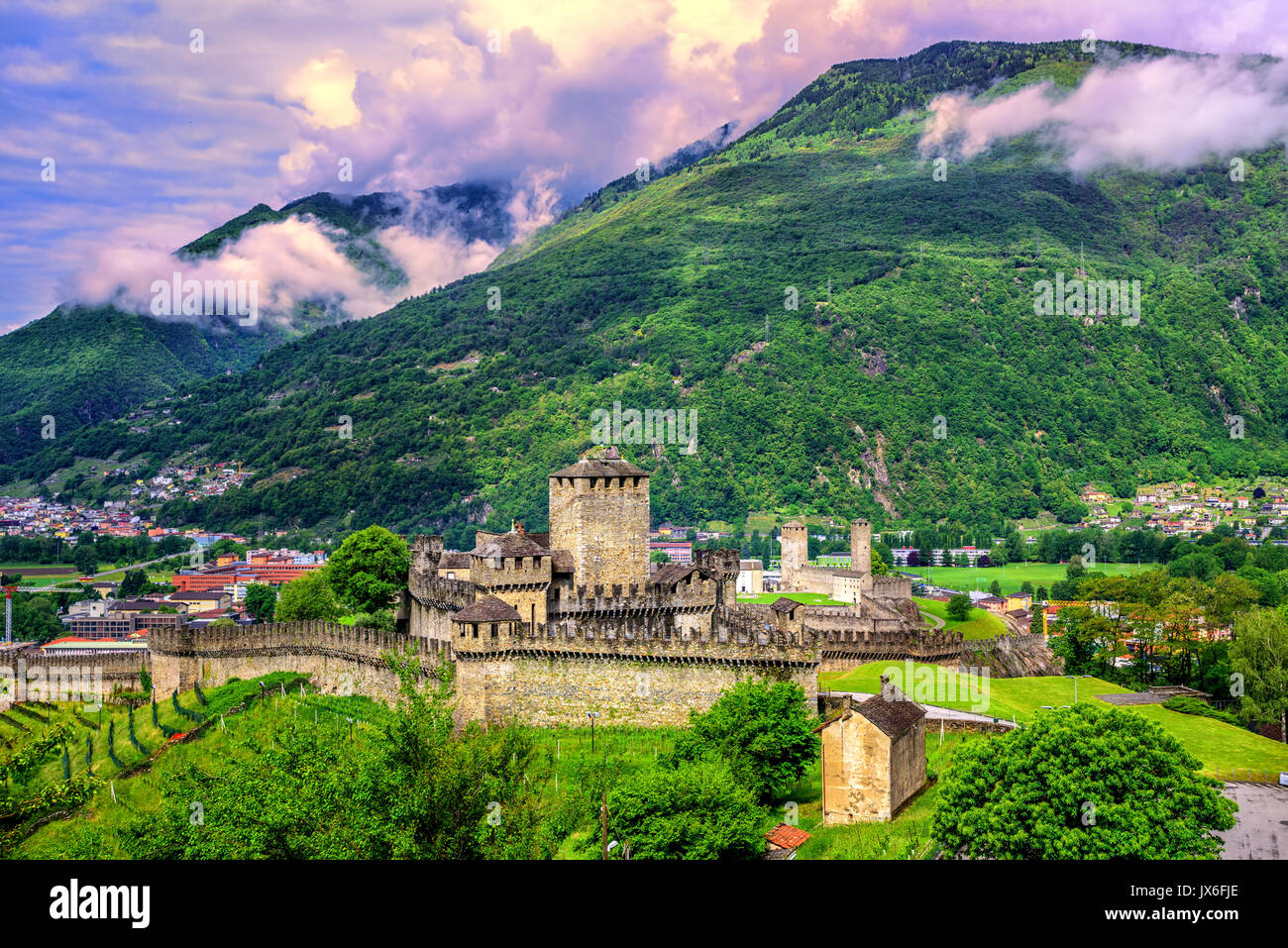 Castello di Montebello in the medieval Old Town of Bellinzona, Switzerland, Alps mountains, in dramatic sunset light Stock Photo